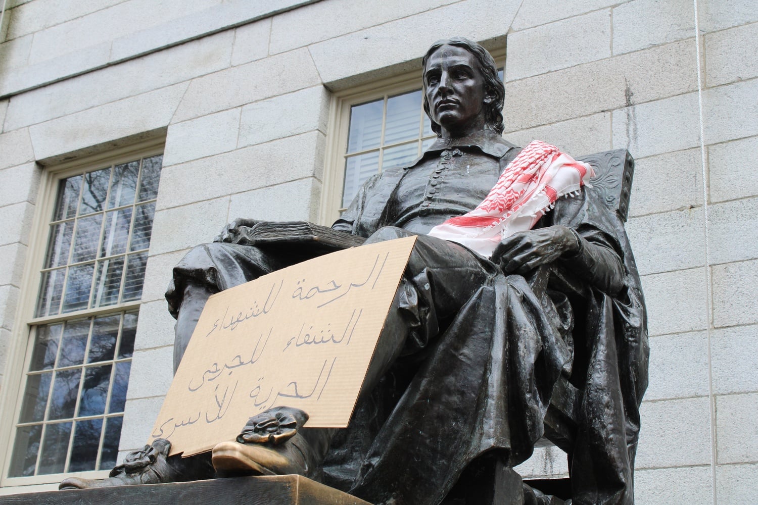 Pro-Palestine protesters termed their encampment the "Harvard Liberated Zone" and draped a keffiyeh over the John Harvard statue.