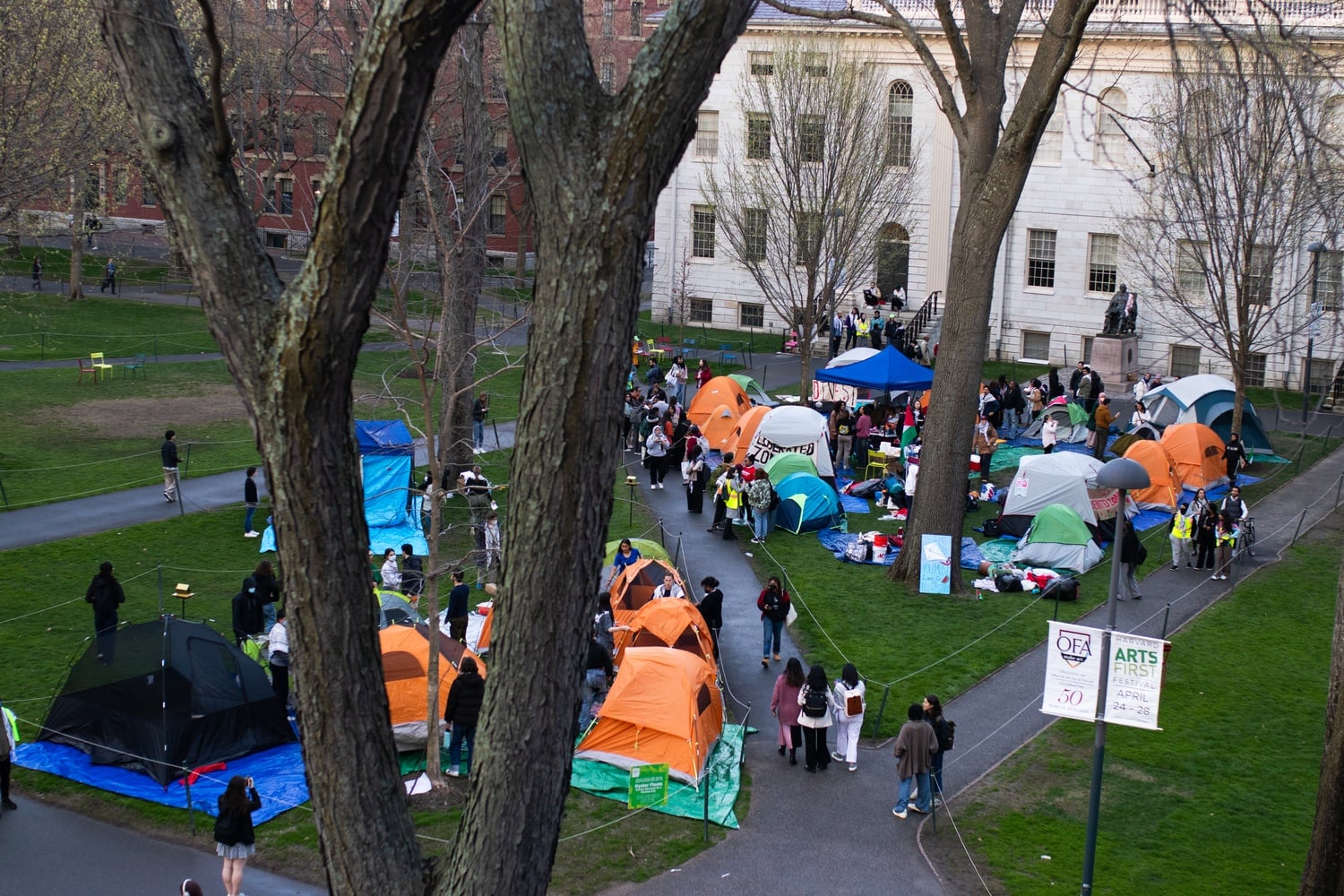 Harvard Out of Occupied Palestine Coalition established an encampment in Harvard Yard Wednesday, demanding the University several its financial ties to Israeli settlements in the West Bank.