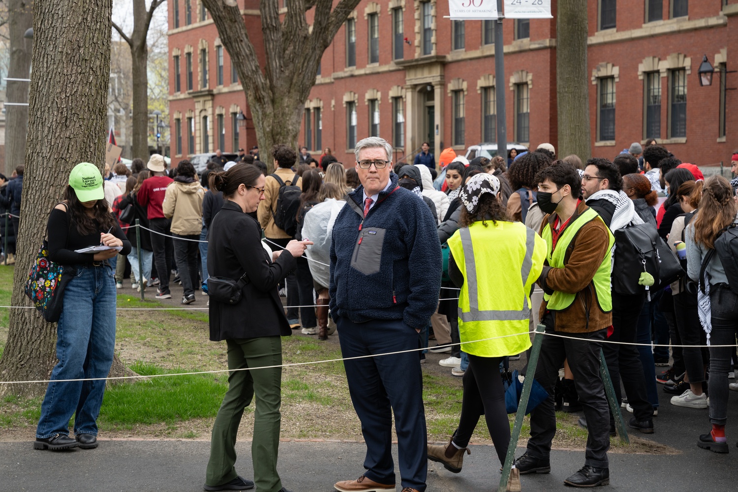 Harvard College Dean of Students Thomas Dunne watches the protest unfold early Wednesday afternoon.