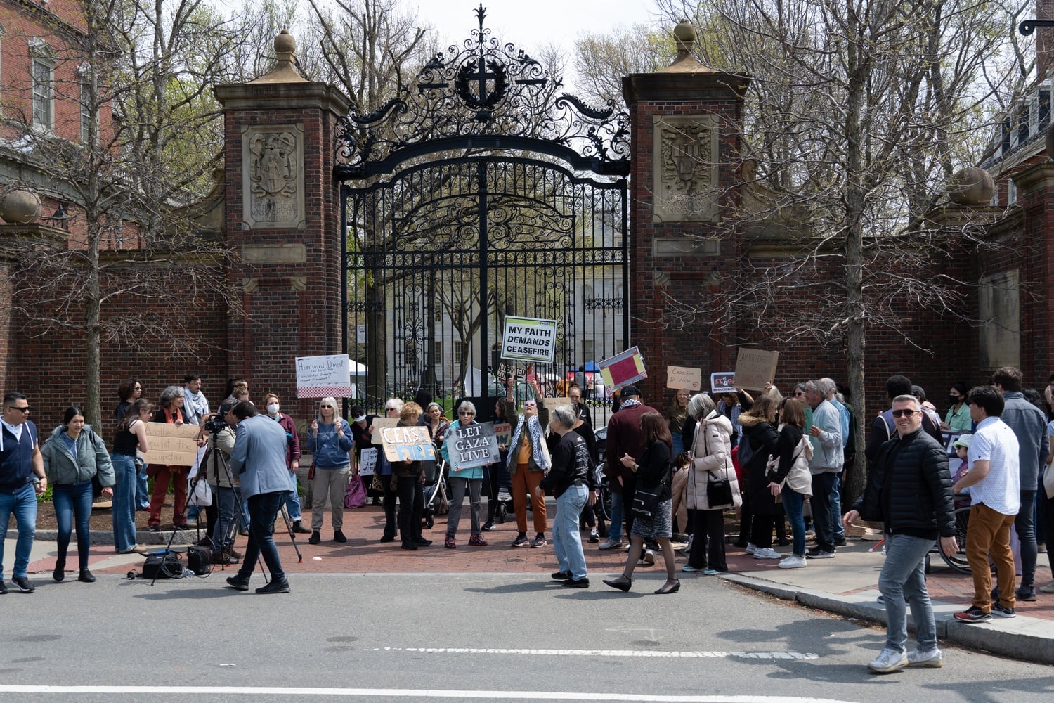 Cambridge residents and non-Harvard affiliates rally at Johnston Gate. The group was organized by Cambridge Residents Alliance in solidarity with pro-Palestine students in the Yard encampment.