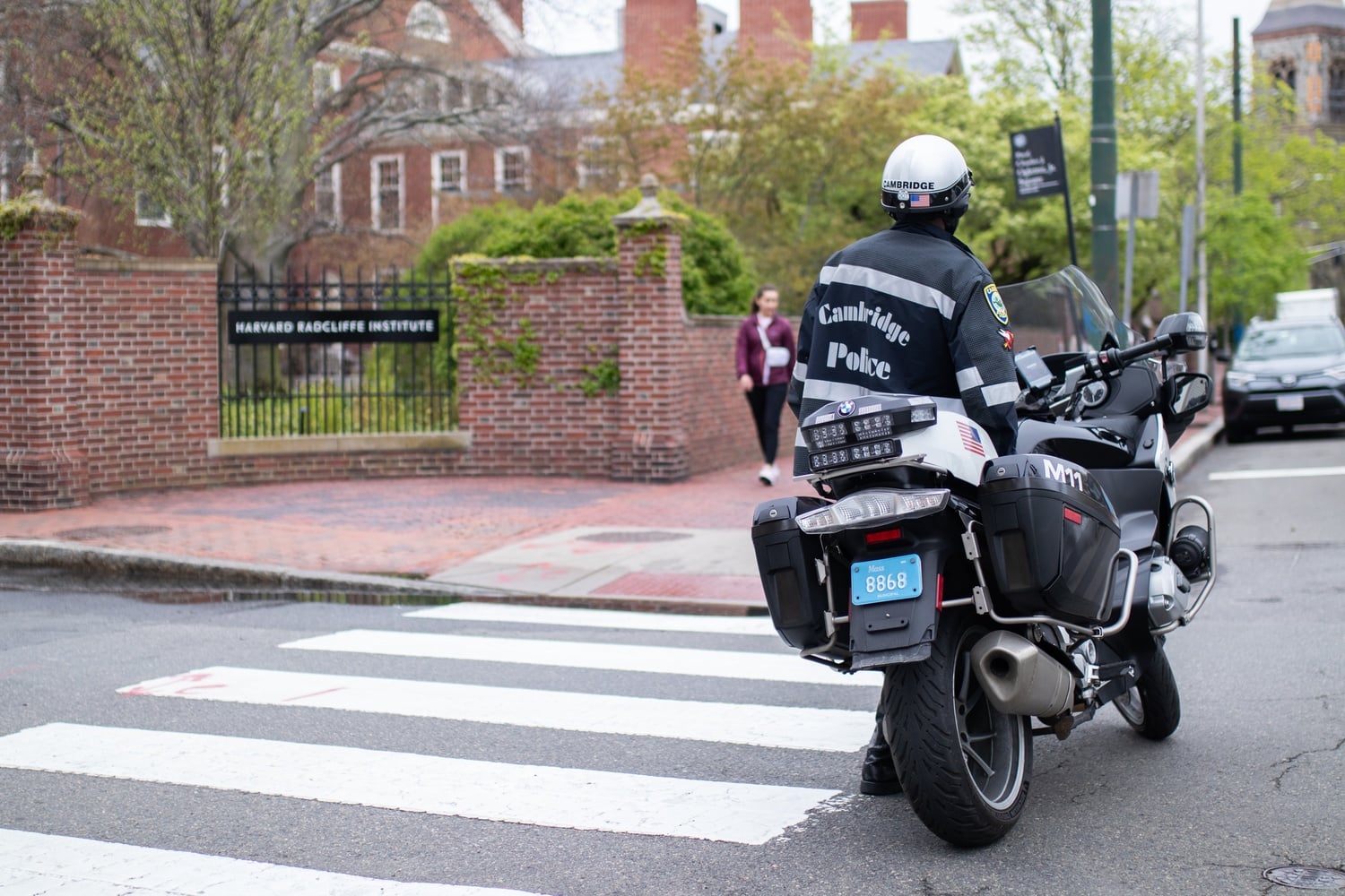 Cambridge Police Department officers were stationed outside of Harvard Radcliffe Institute on Tuesday. The Cambridge City Council discussed a resolution urging Harvard administration and city leadership to respect students' right to peaceful protest.