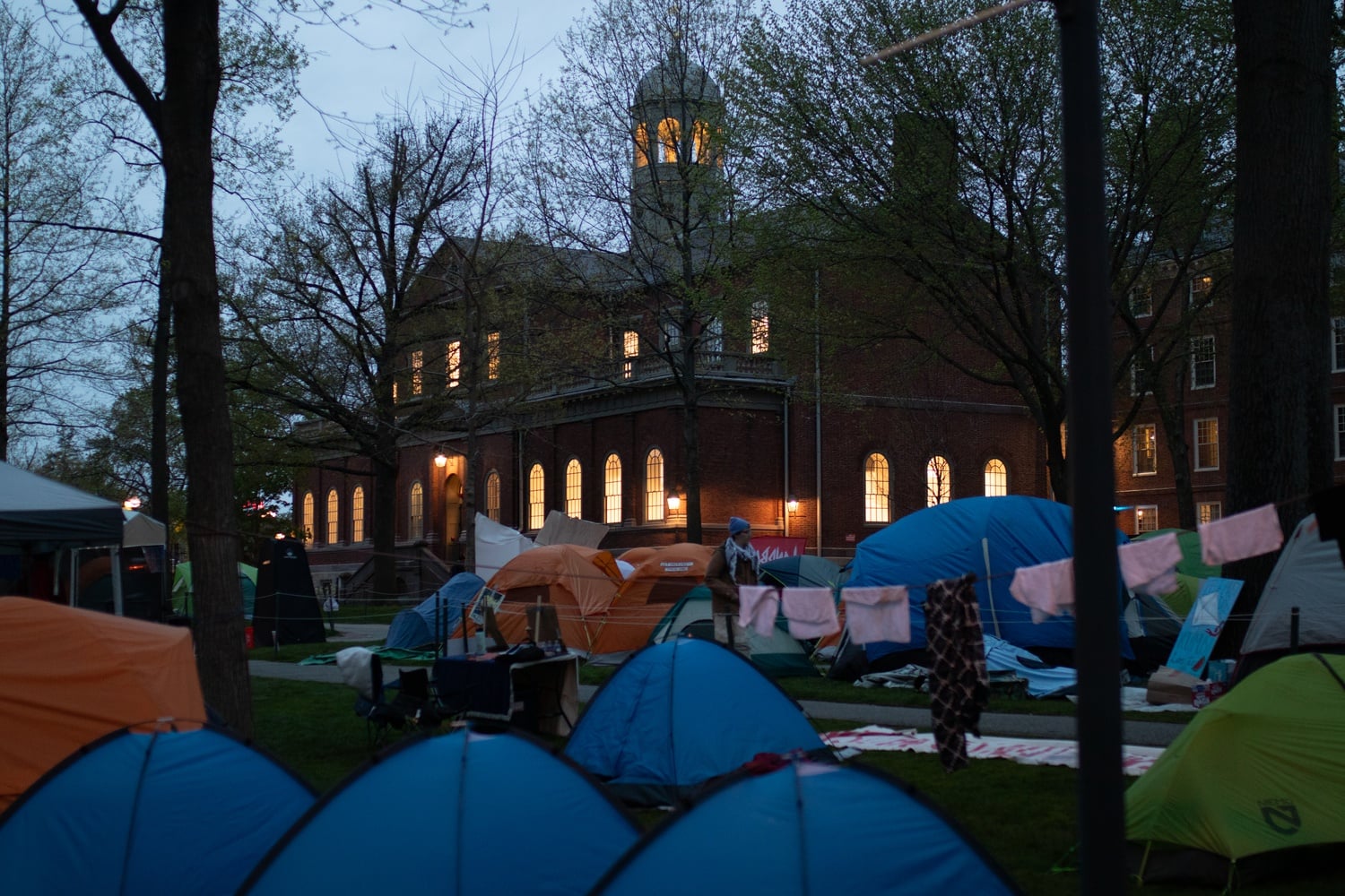 Final exams scheduled for Harvard Hall were moved to a new location as the pro-Palestine encampment in Harvard Yard looks set to last into the start of Harvard College's exam period.