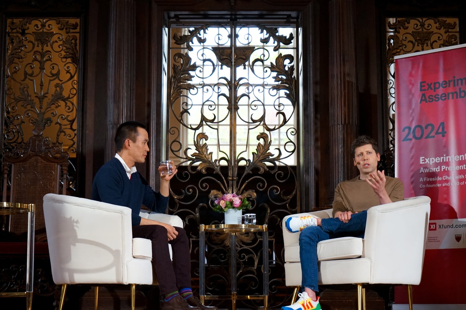 Sam Altman, right, speaks at a packed event in Memorial Church on Wednesday.