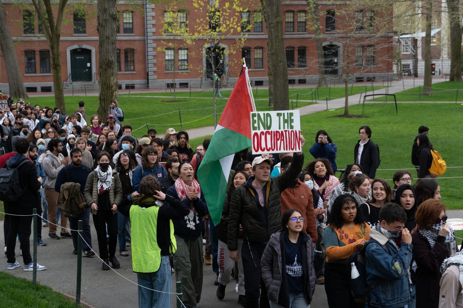More than 200 demonstrators march through Harvard Yard on Wednesday afternoon in a rally to demonstrate solidarity with protesters at Columbia University.