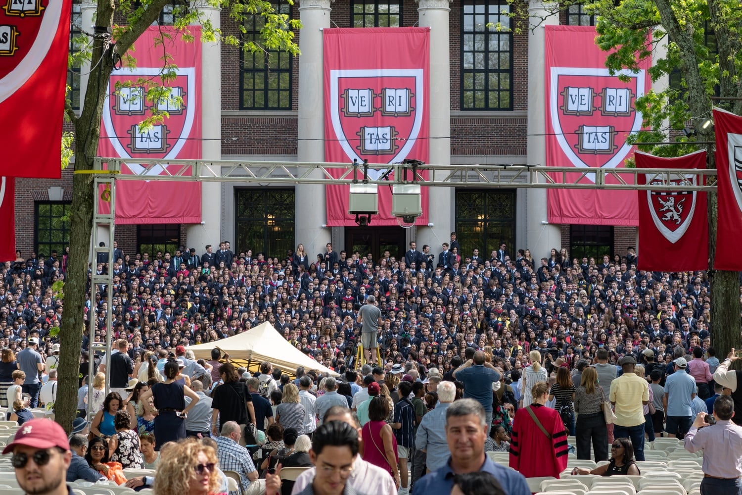 The Harvard College Class of 2024 poses for a photo on the steps of Widener Library on Tuesday.