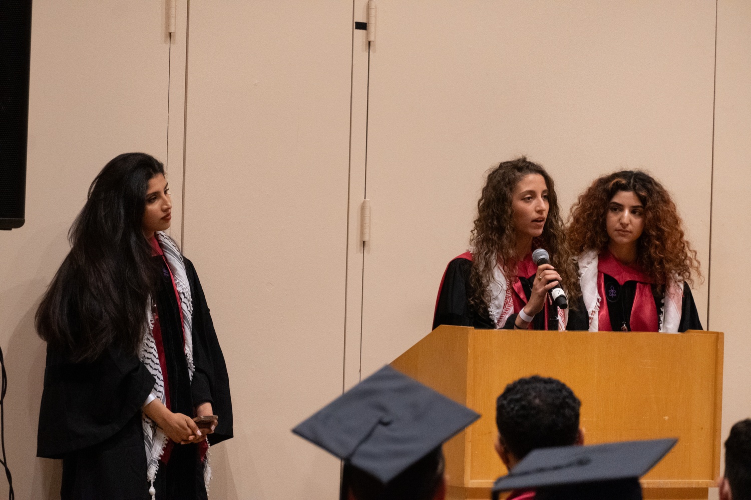 Harvard Law School graduate Tala A. Alfoqaha addresses students at the University's affinity celebration for Arab graduates.