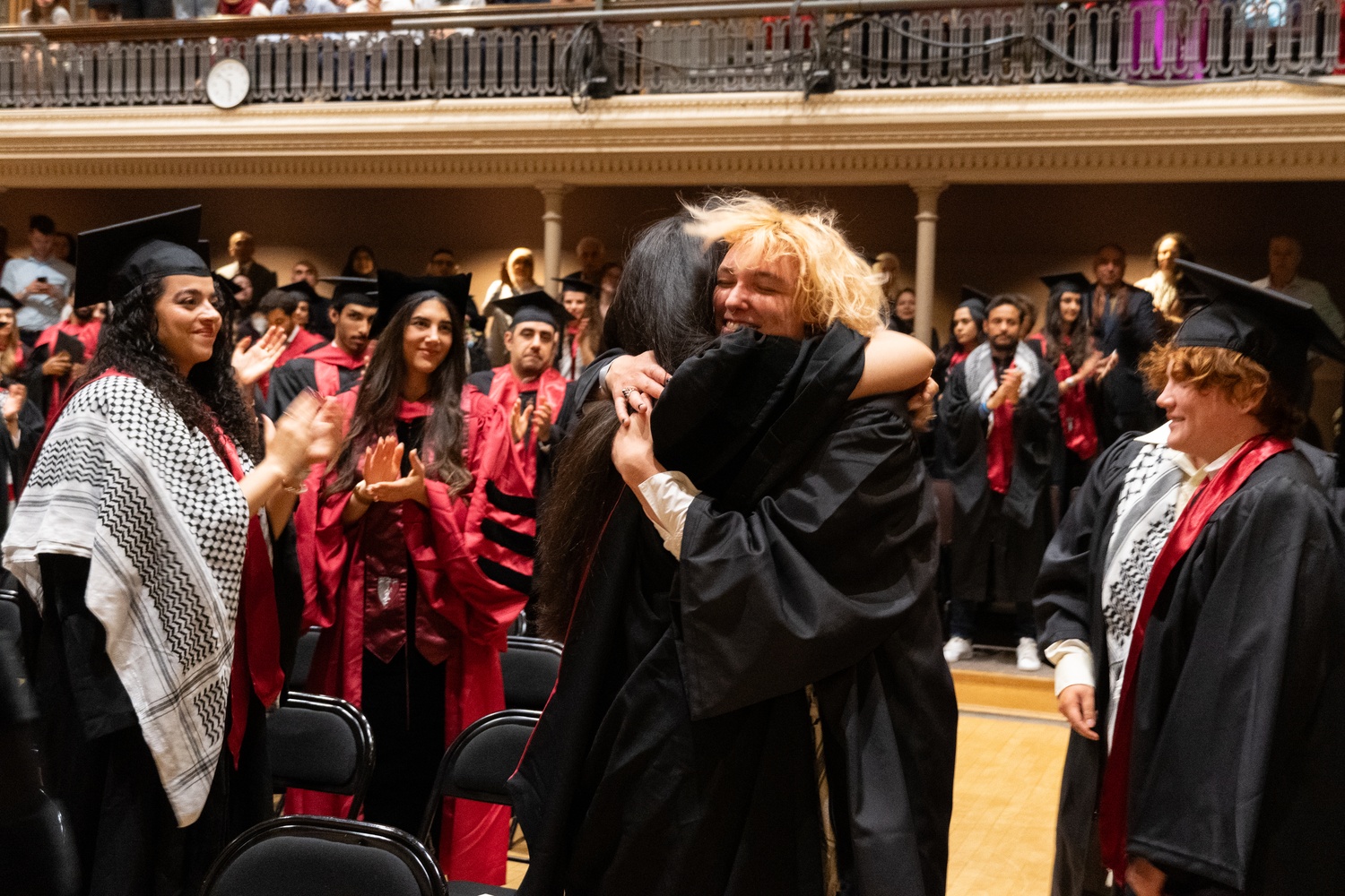 Syd D. Sanders ’24 embraces another student at the affinity celebration for Arab graduates. Sanders was among eight seniors honored at the celebration after they were disciplined by the Harvard College Administrative Board.