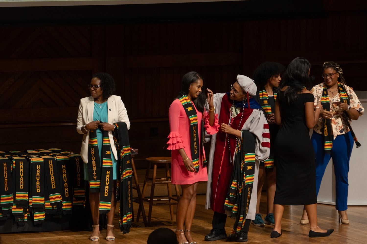 A student receives their stole at the Harvard Black student affinity graduation ceremony.