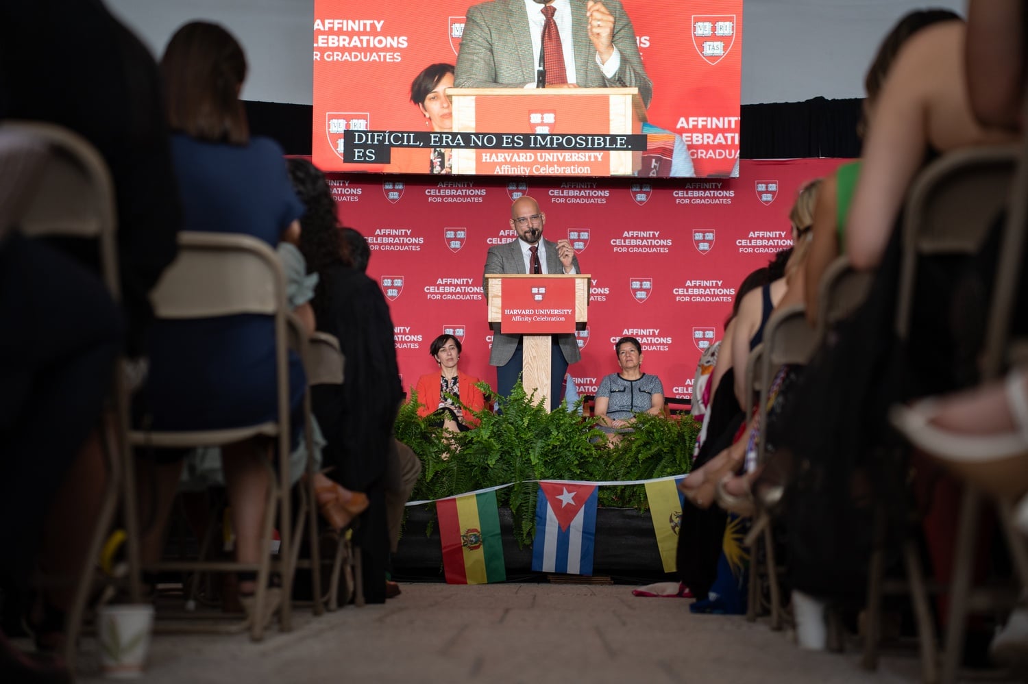 Harvard Law School Professor Andrew M. Crespo '05 speaks at the Latinx affinity graduation. Crespo urged graduates to remember their families' contributions.