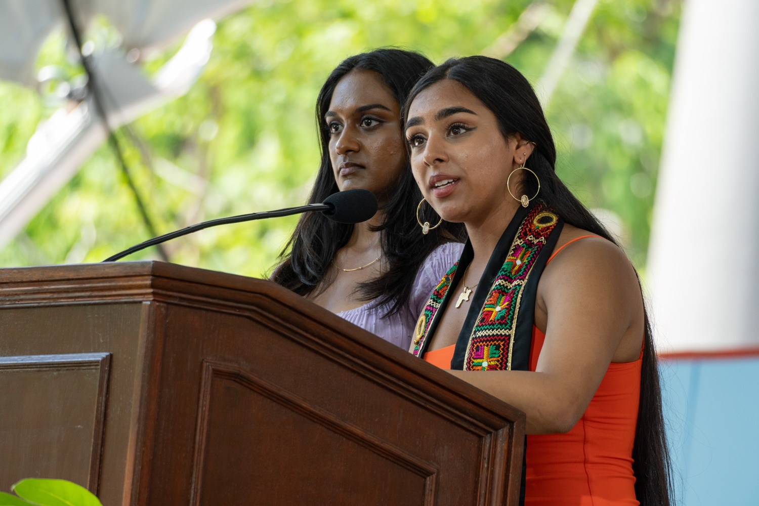 Tarina K. Ahuja '24 and Shruthi S. Kumar '24 read the first names of the 15 College seniors disciplined by the Ad Board for their participation in the 20-day encampment.