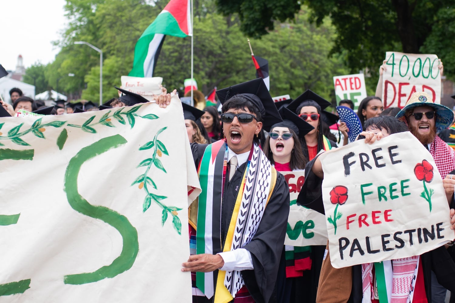 Students walk out of Harvard's Commencement ceremonies in protest. The mass discontent over Harvard's denial of 13 students their degrees over their participation in the pro-Palestine encampment overshadowed the day of pomp.