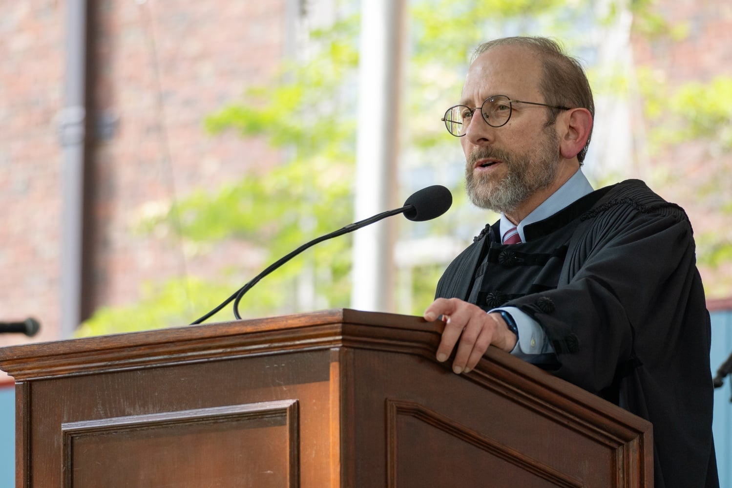 Harvard President Alan M. Garber '76 delivers a Commencement-wide address. He traveled to Georgia last month for a conference that brings together influential conservatives annually.