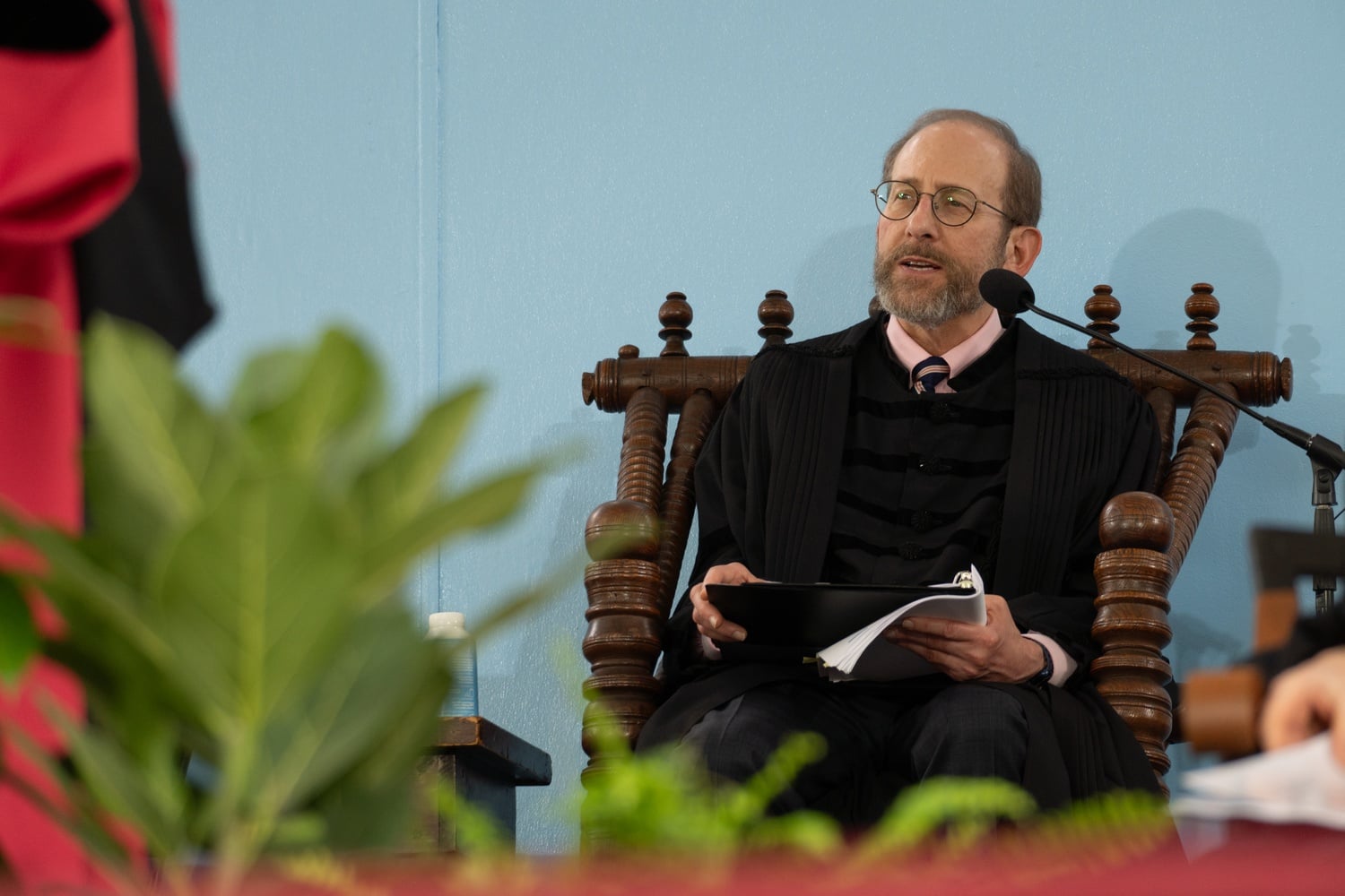 Harvard President Alan M. Garber '76 sat onstage during the University's May 2024 Commencement ceremony. Garber joined a Tuesday statement accusing the Trump administration of 'political interference' in higher education.