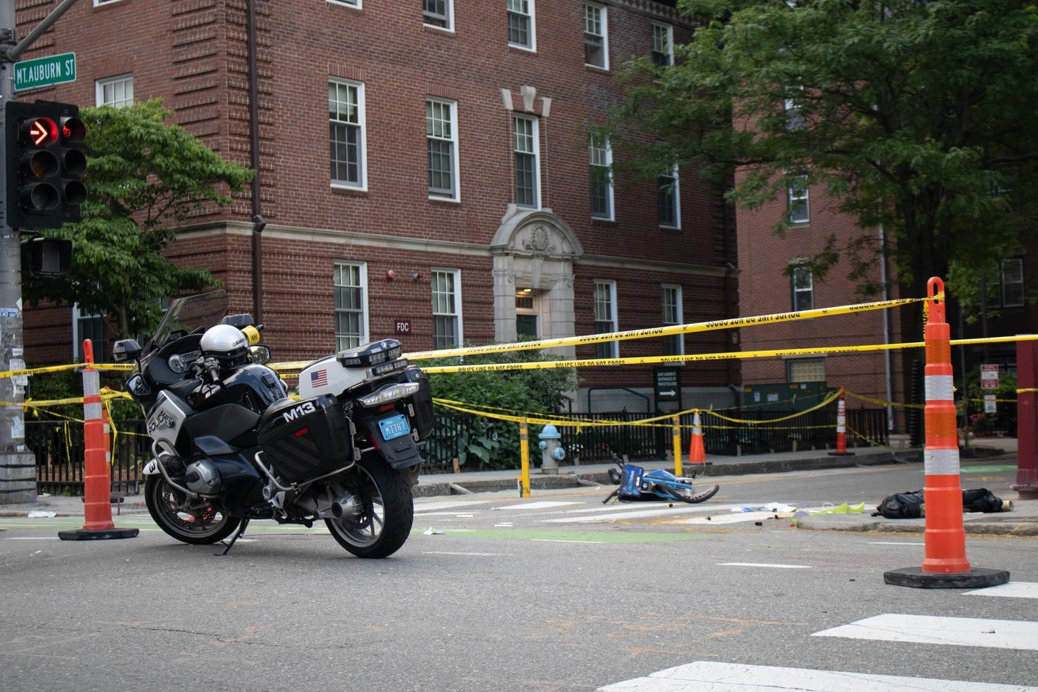 Police vehicles and yellow tape surround the site of Friday's crash, which resulted in the death of a 55-year-old Florida woman.