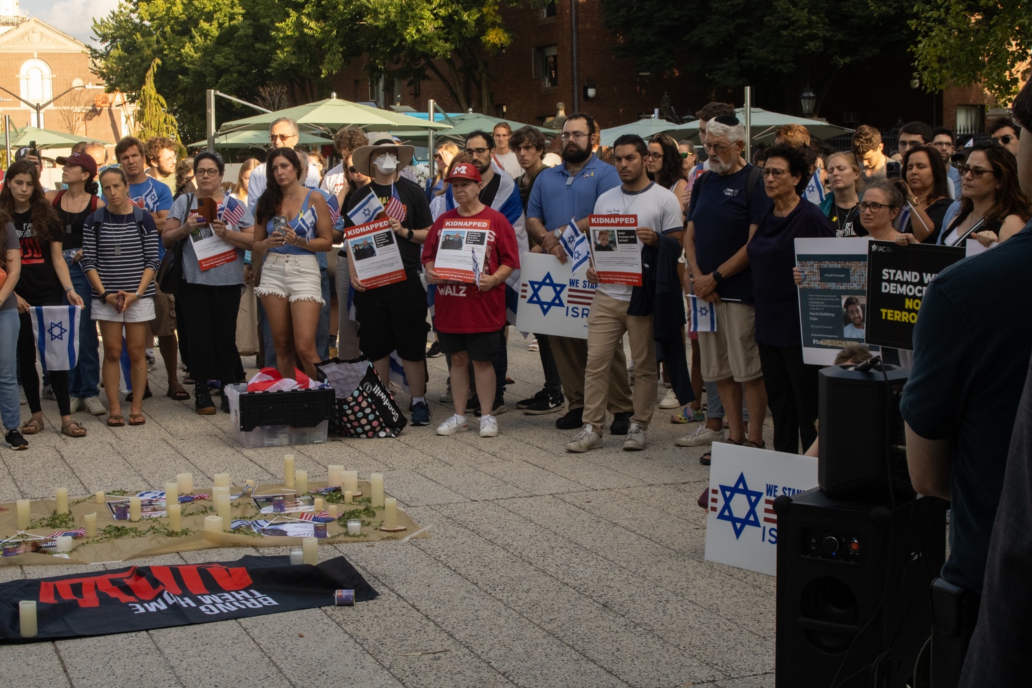 The Sunday vigil was attended by roughly 200 Harvard affiliates. Many attendees carried Israeli and American flags as well as posters with information about hostages still in captivity.