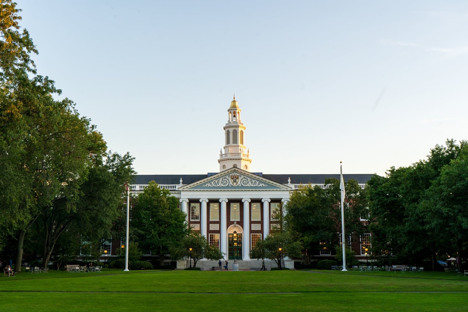 Two graduate students were charged in May for their involvement in a 'die-in' protest at Harvard Business School. On Monday, a judge dismissed hate crime charges, though both are still facing charges of assault and battery.