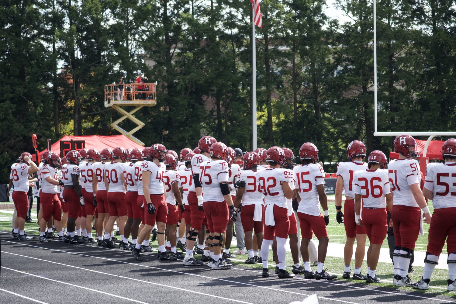 Harvard football players line up at their Sept. 28 Ivy League season opener against Brown. The Ivy League announced last week that its champion football team would receive a spot in the NCAA's Division I Football Championship Subdivision playoffs.