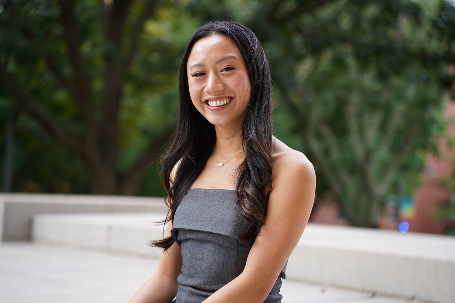 Elise M. Pham ’26 poses for a portrait on the steps of Widener Library.