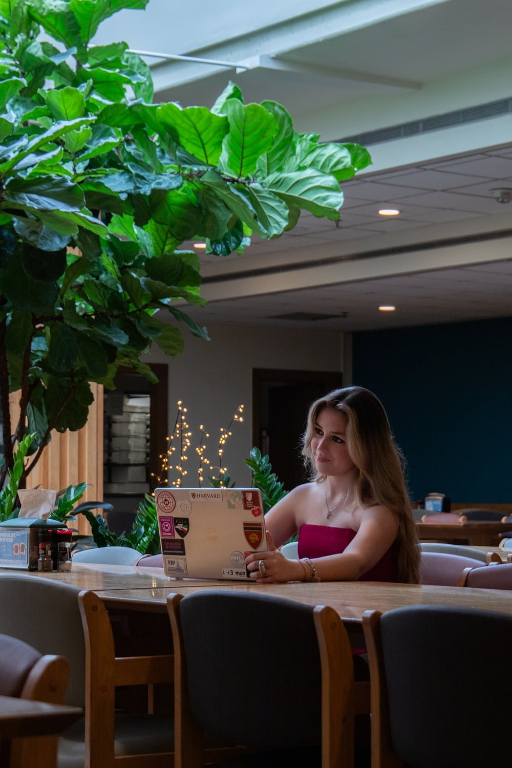 Indiana Vargas Avellan ’27 poses for a portrait in the Currier house dining hall.