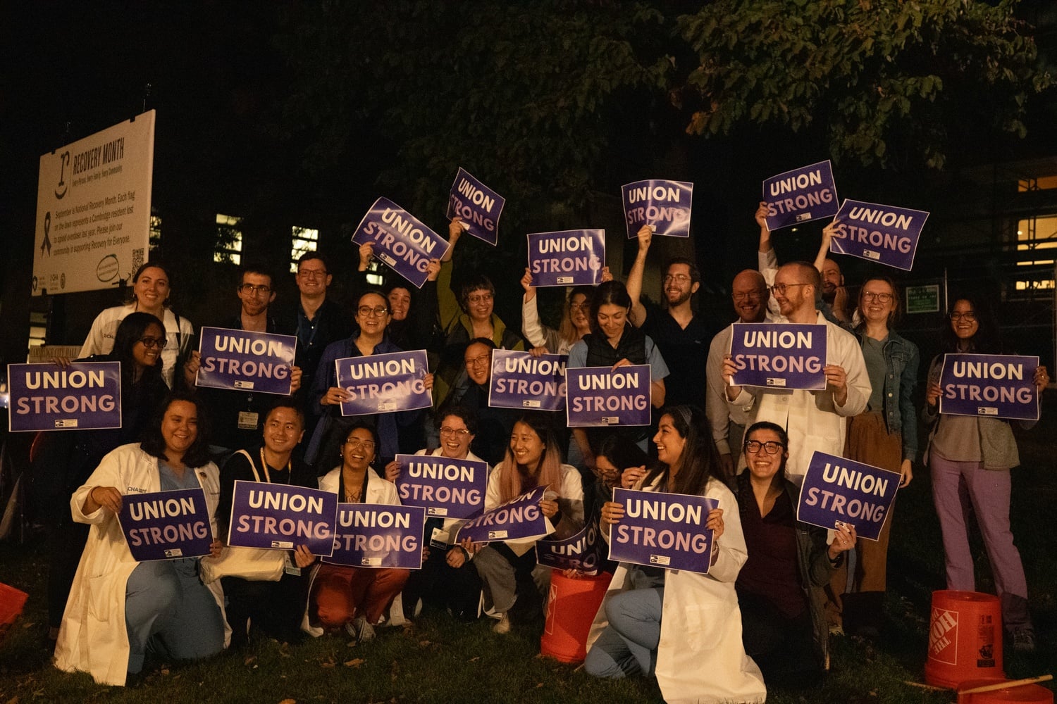 Cambridge Hospital Alliance workers protest outside of the Cambridge City Hall.