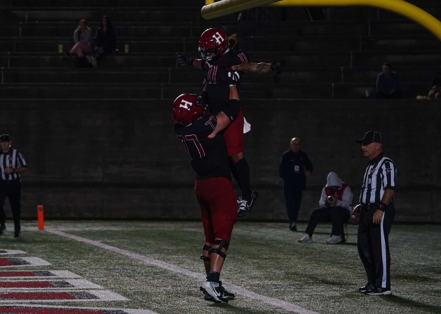 Sophomore Spencer Doan lifts running back Xaviah Bascon in the air to celebrate a touchdown against the New Hampshire Wildcats.