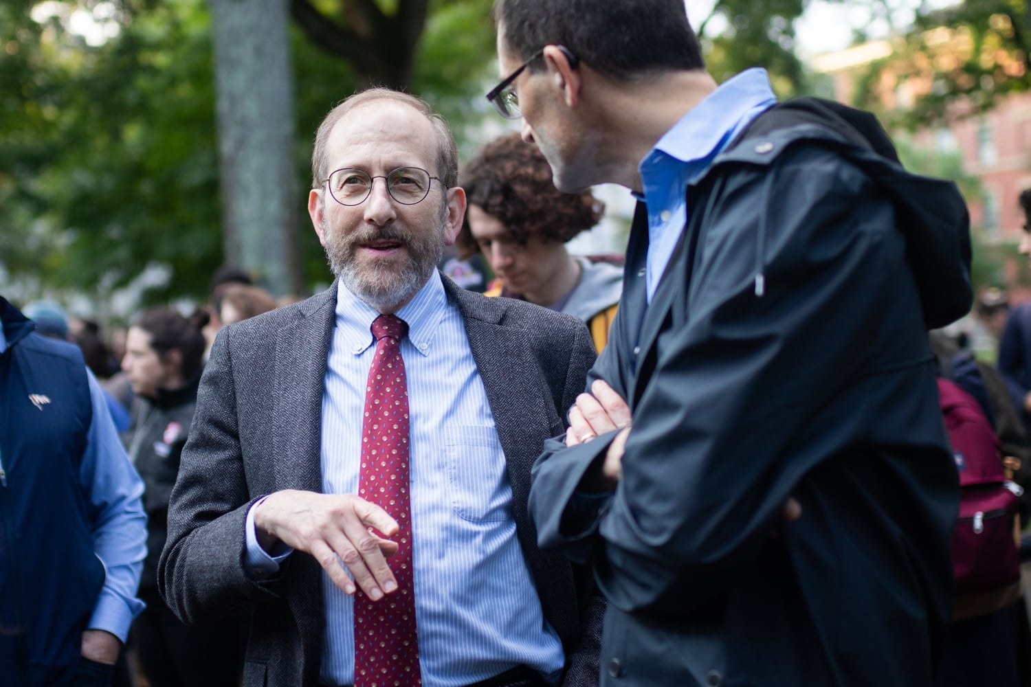 Harvard President Alan Garber '76 stands during the vigil.