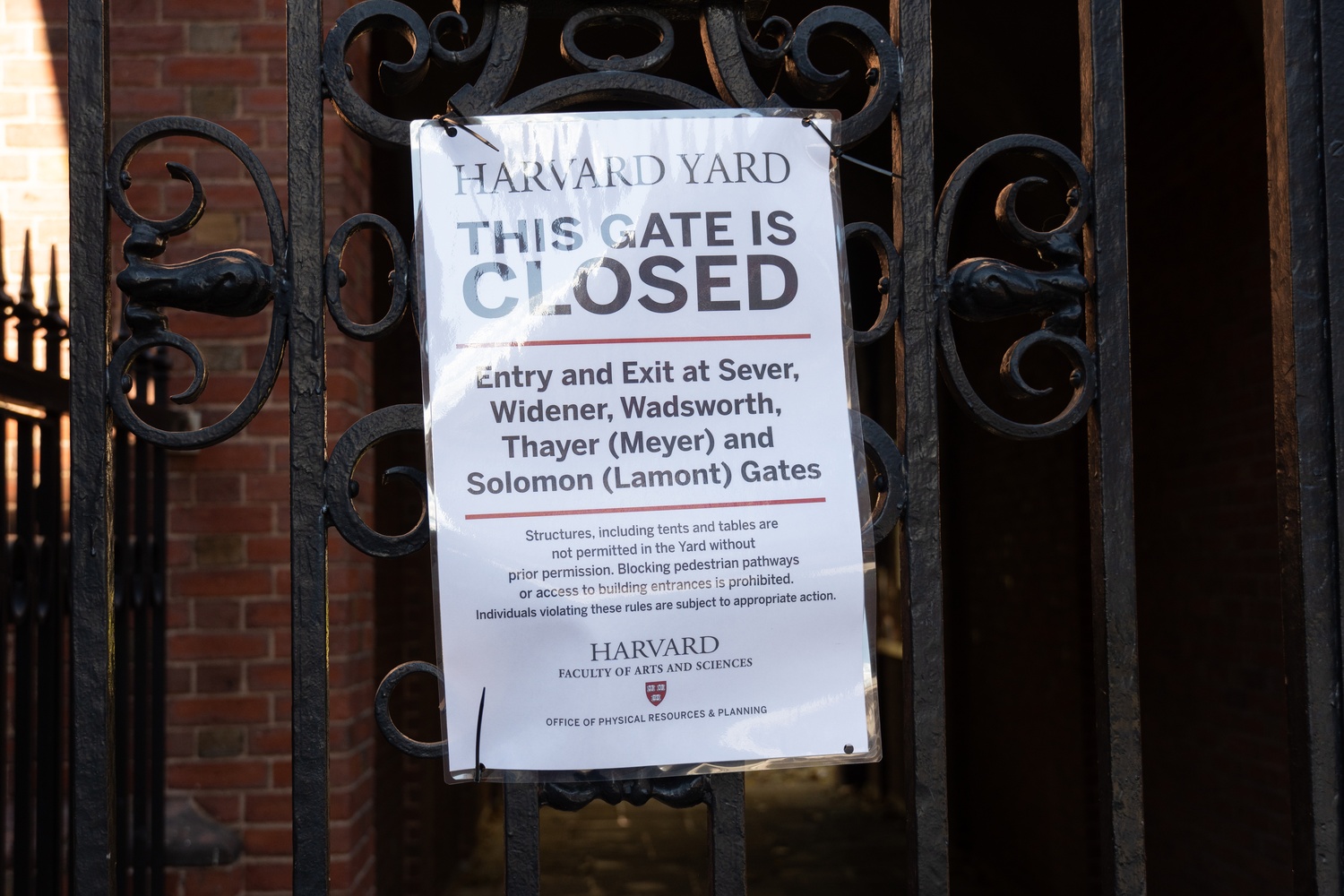 Harvard restricted access to the Yard overnight to only Harvard University ID holders n the wake of a vandalization of University Hall and the John Harvard Statue.