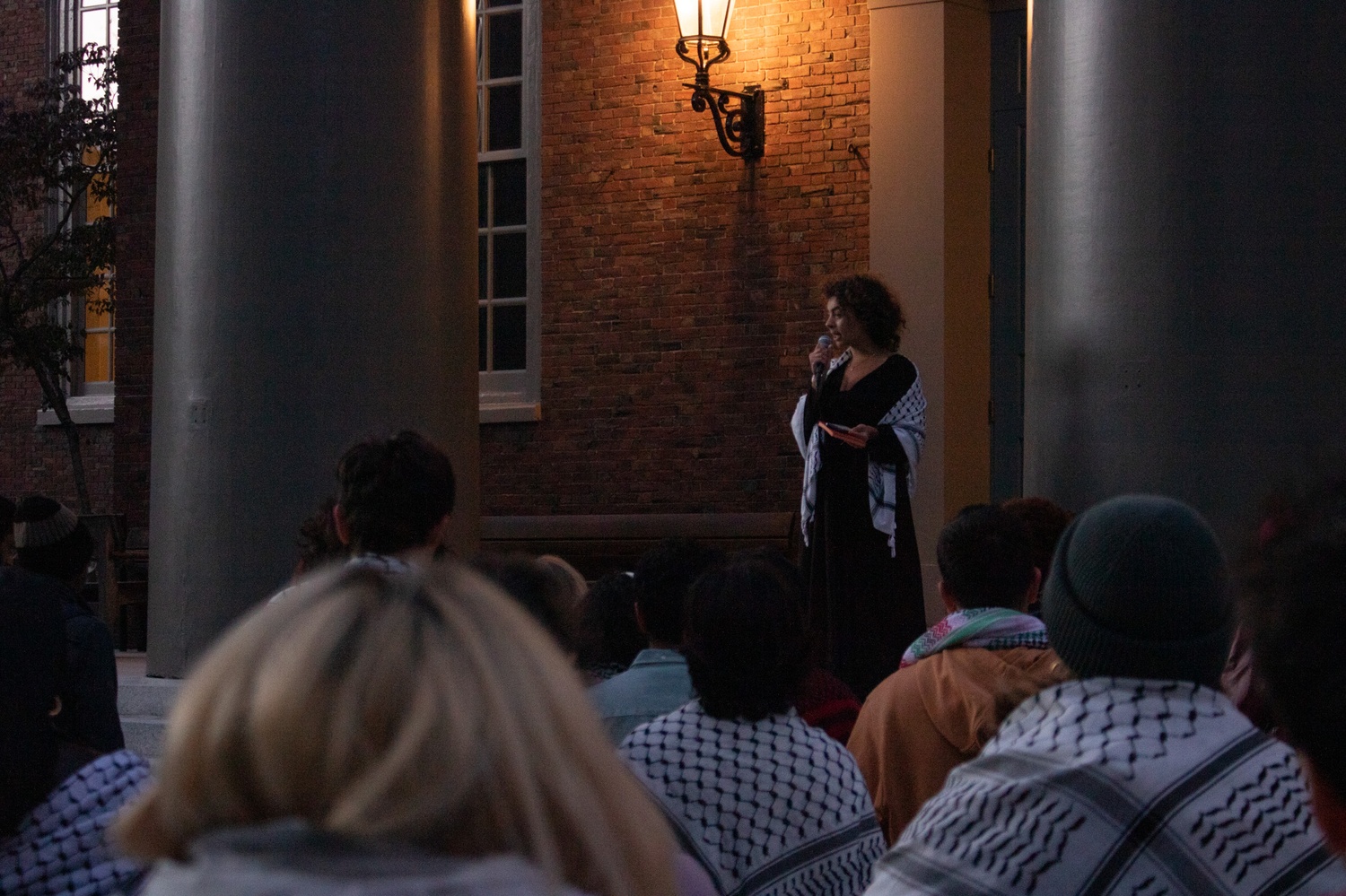 Students gather on the steps of Memorial Church for a vigil hosted by the Harvard Undergraduate Palestine Solidarity Committee.