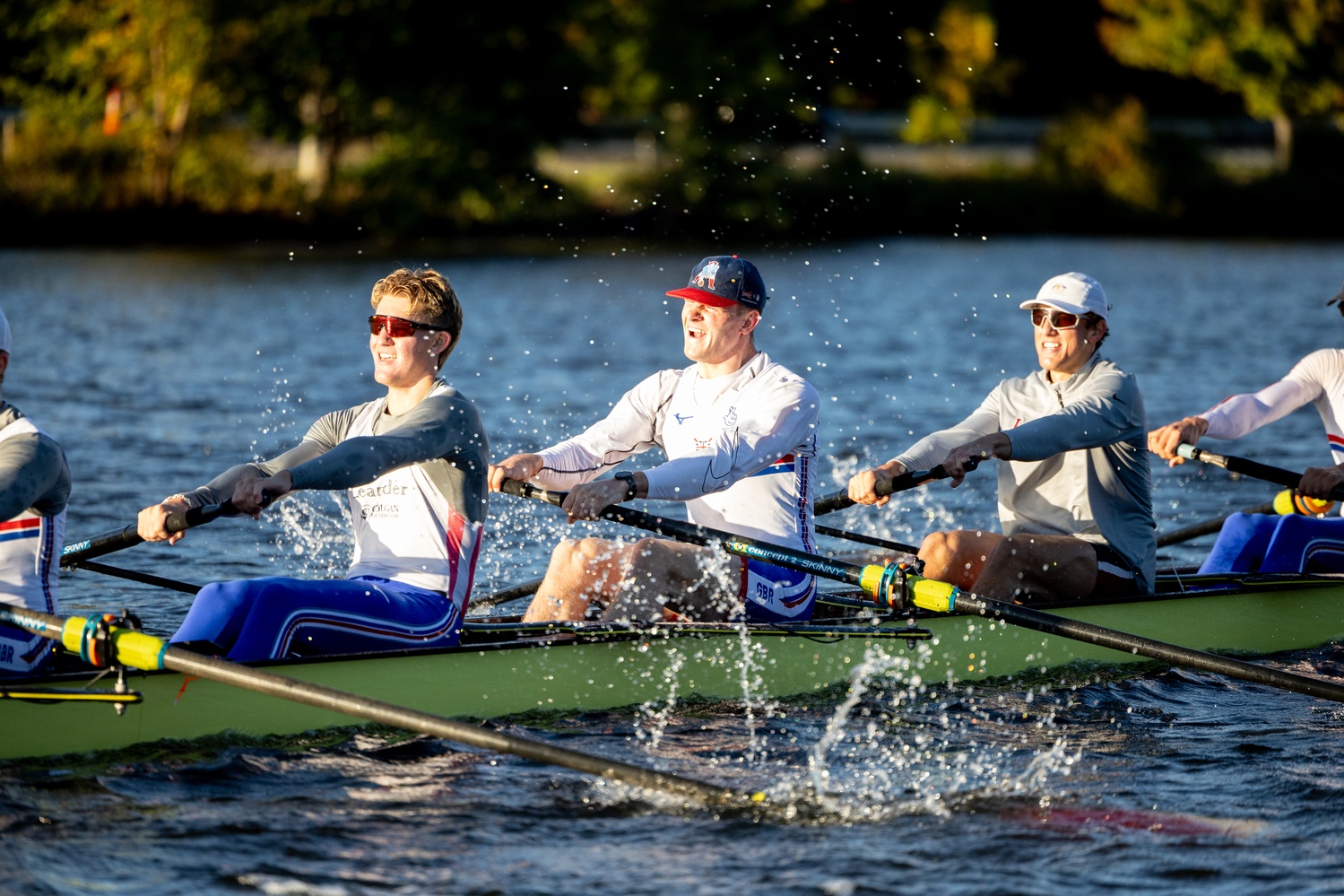 Obholzer rows along the Charles with his crew.