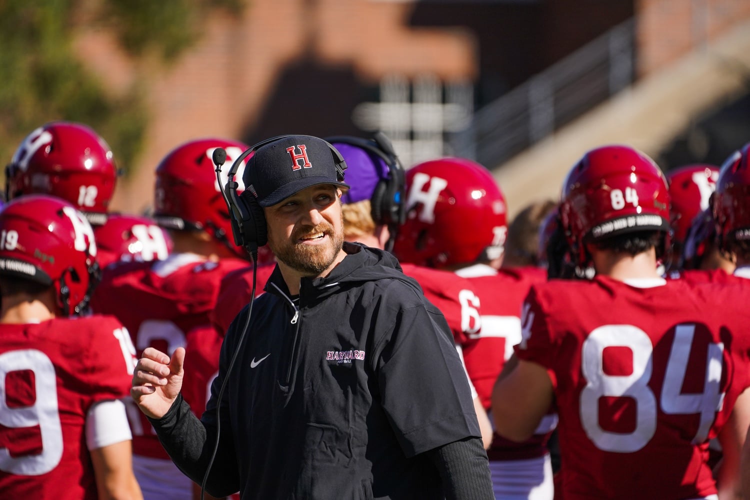 Head Coach Andrew Aurich looks on as the Crimson battle in-state foes Holy Cross at Harvard Stadium