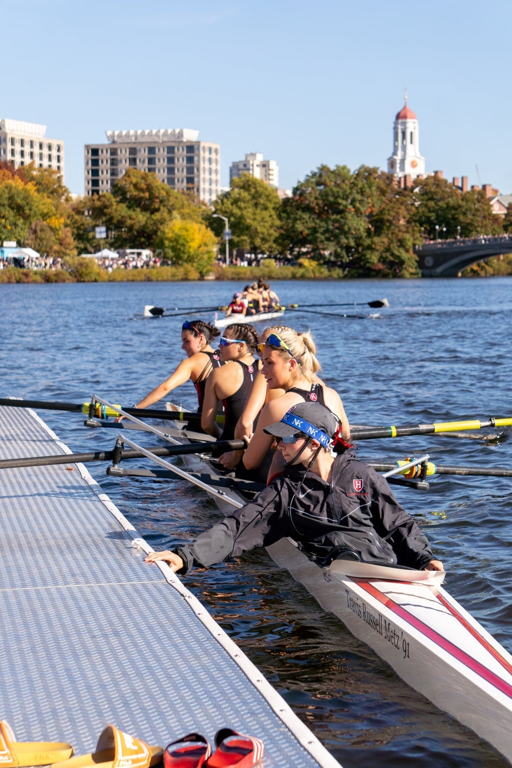 The Harvard women's lightweight boat sets off to compete in the 2024 Head of the Charles Regatta. The lightweight eights had a disappointing fourth-place this year, failing to defend their HOCR title.
