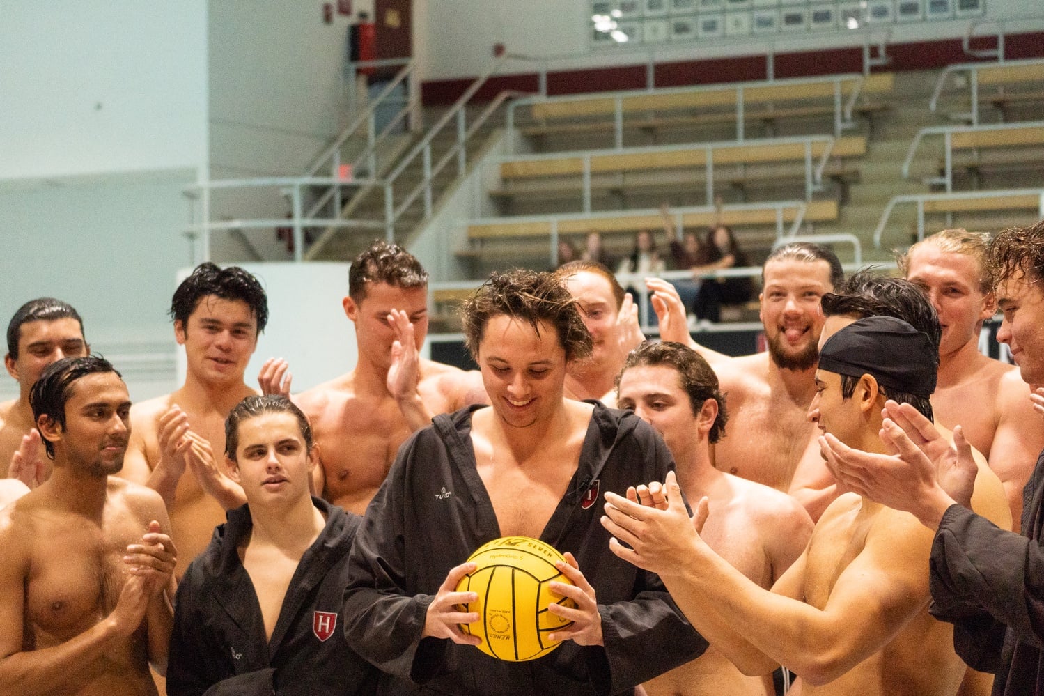 Top of the Hill: Junior James Rozolis-Hill celebrates with his teammates after breaking Harvard's all-time scoring record on Oct. 12.