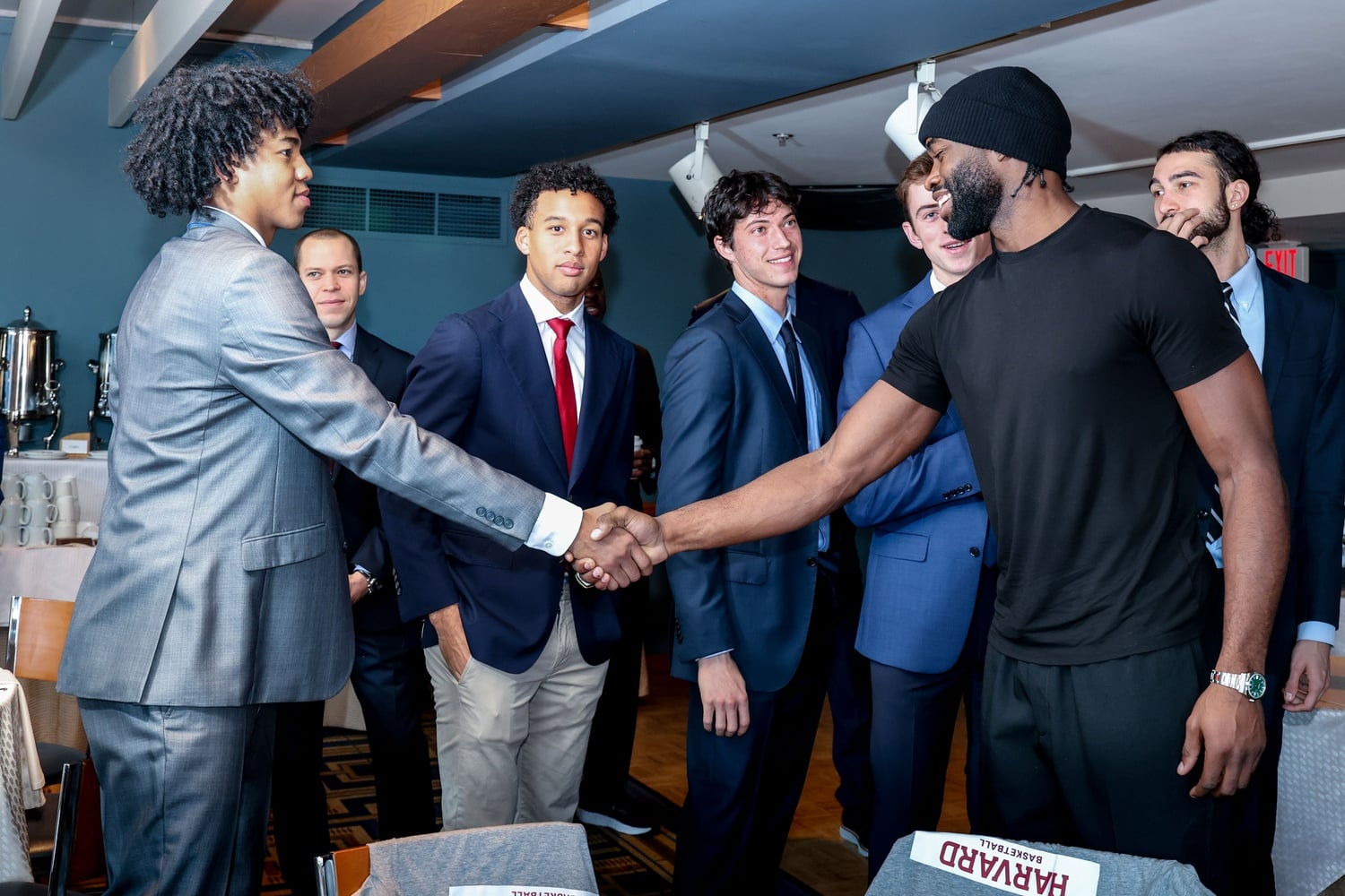 Members of the Harvard men's basketball program meet Celtics star Jaylen Brown at The Breakfast Club.