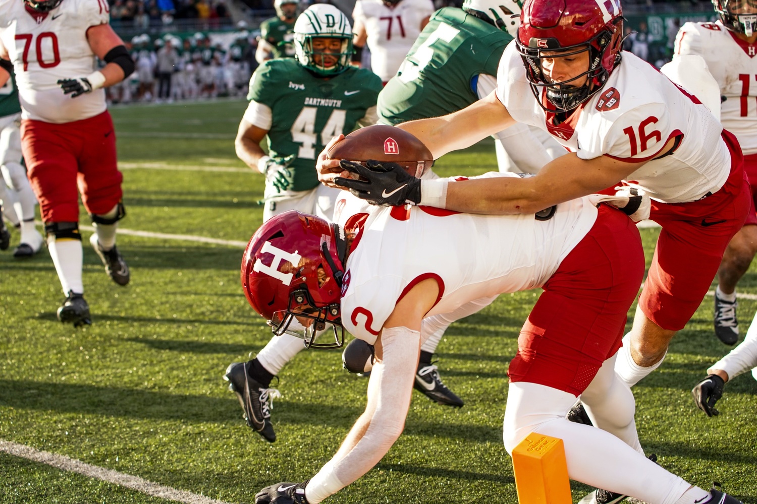 Dancing along the sidelines, senior utility man Charles Deprima stretches out his hand to secure the Crimson's game-winning touchdown.