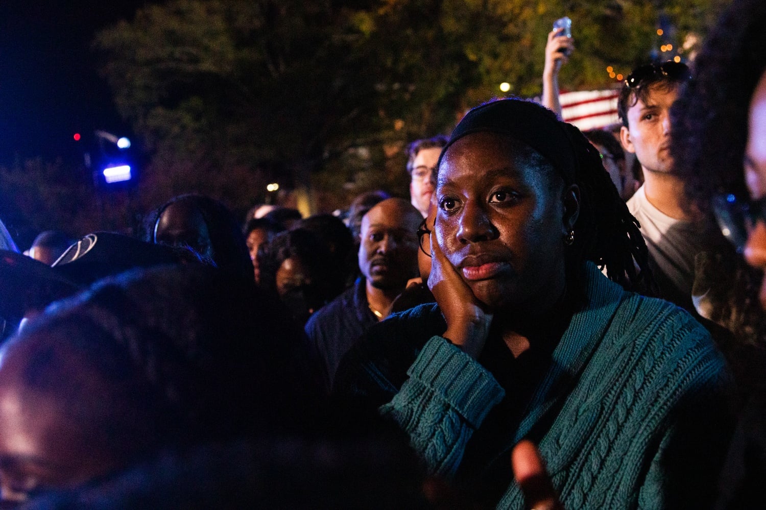 An attendee at Harris's election night watch party looks on as Harris's election hopes dwindle.
