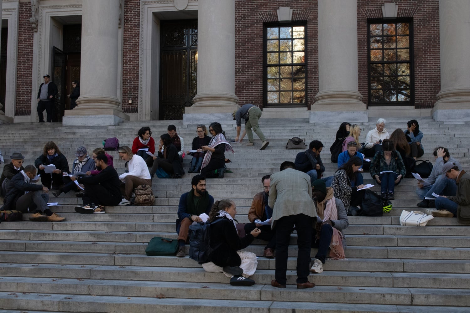 Faculty began the protest on the front steps of Widener, where they listened to speeches before splitting into groups to discuss readings on free speech, dissent, and 'the historical role of libraries in anti-fascist resistance.'