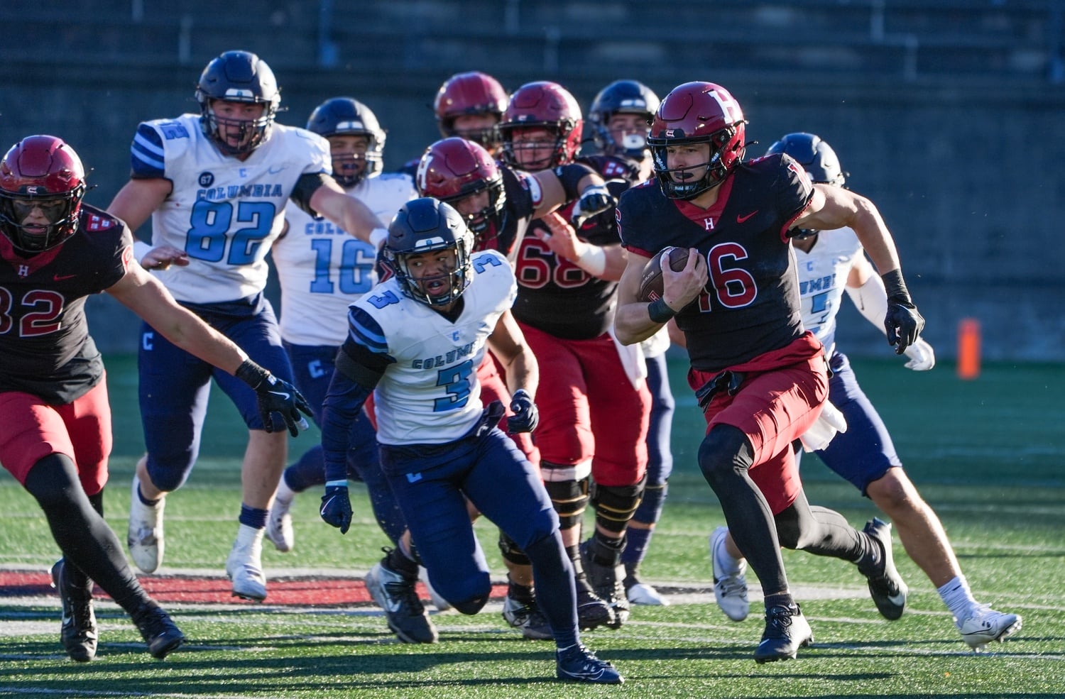 Senior utility man Charles DePrima rushes past the Columbia defense during a game at Harvard Stadium on Saturday.