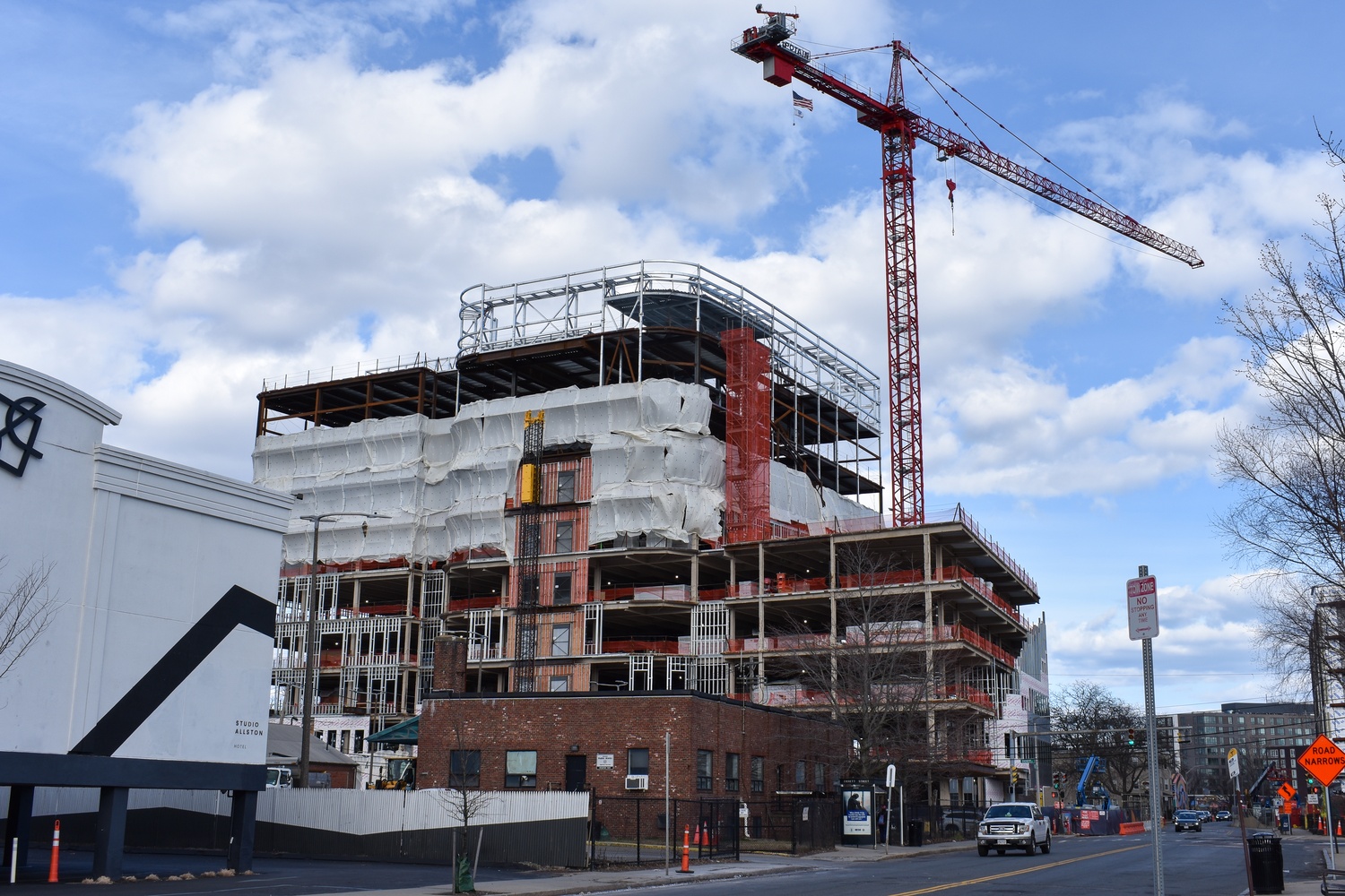 Allston building undergoes construction on Soldiers Field Rd. Residents of the Boston neighborhood have asked Harvard to invest more in promised contributions.