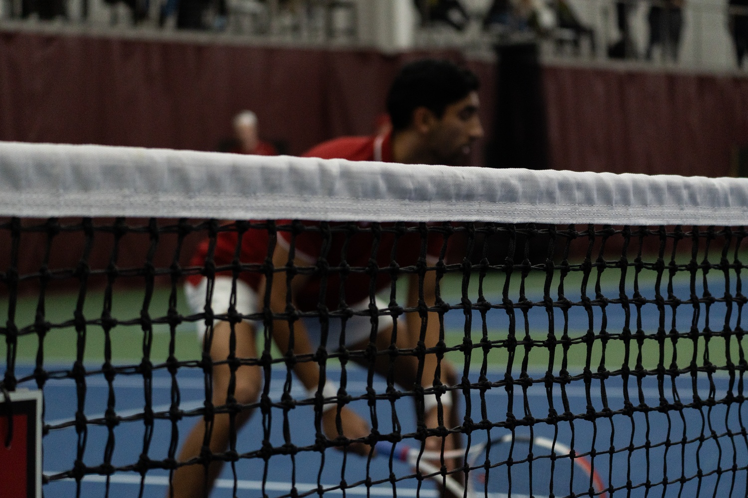 Then-sophomore Masa Perera prepares for doubles play in a match against Duke this spring. Perera will be a key piece for the Crimson this coming spring.