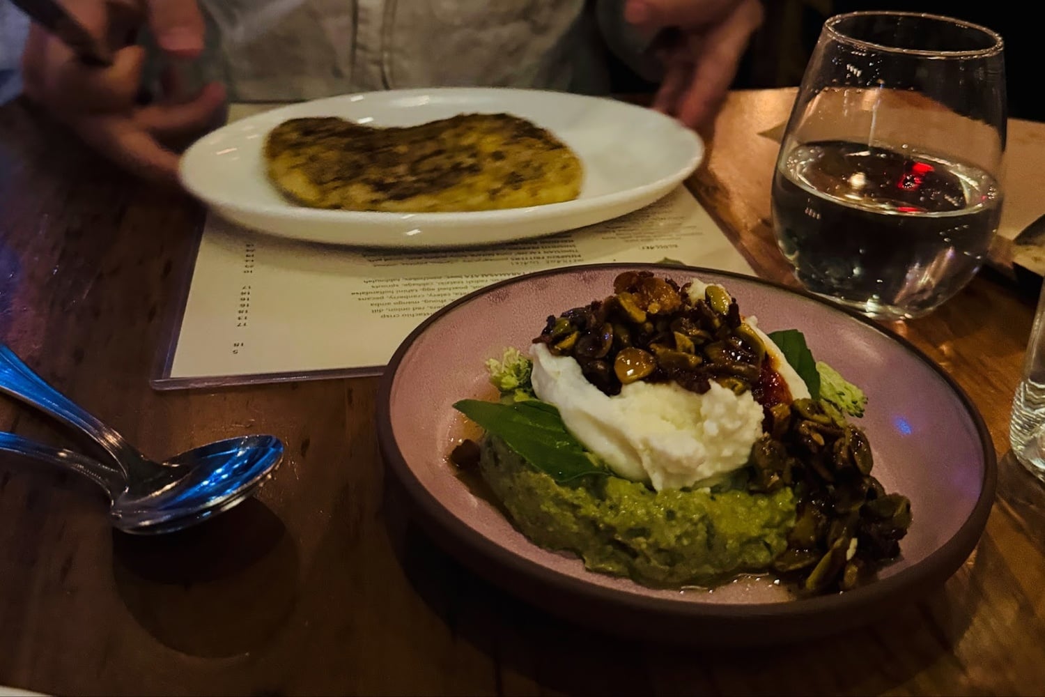 The avocado muhammara — an avocado- and burrata-based twist on the classic spicy red dip — unfortunately does not come with bread included, which feels a little counterintuitive.