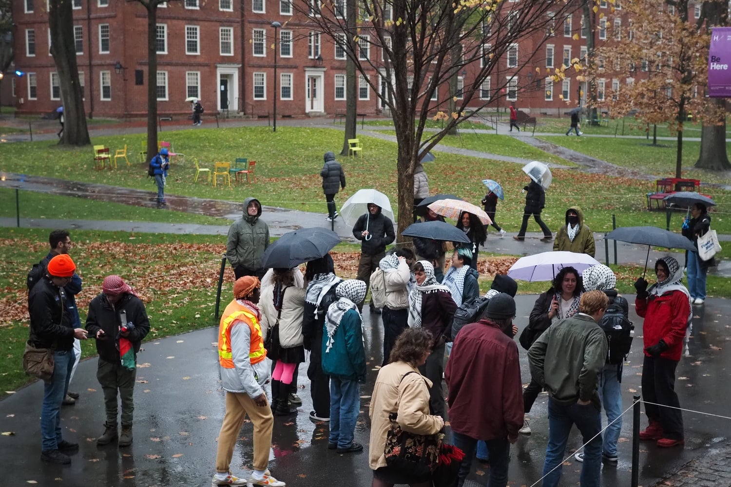 Protesters gather in front of the John Harvard Statue on Thursday afternoon.