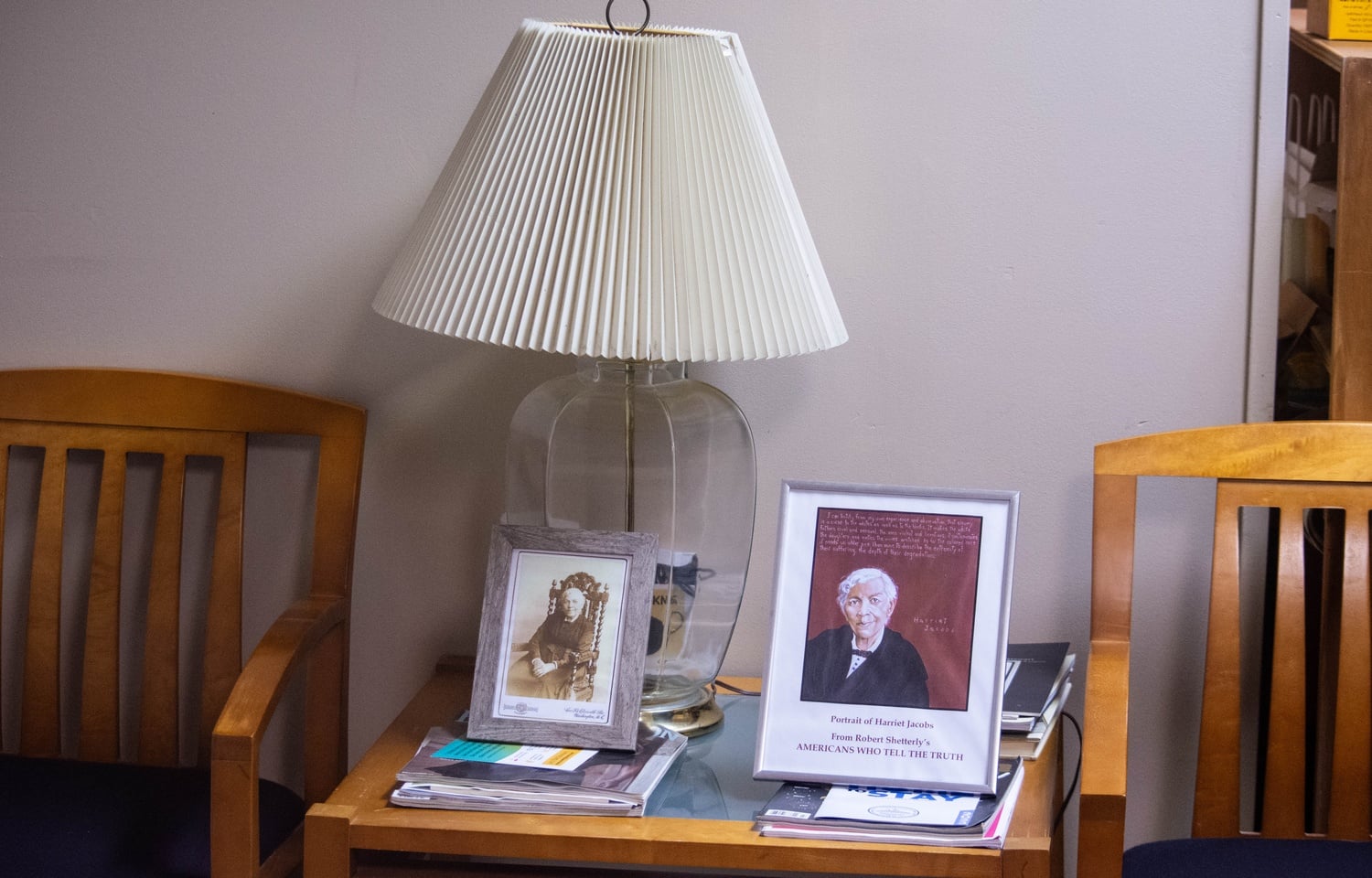A photograph and a portrait of Jacobs sit in the lobby of the 17 Story St. building.