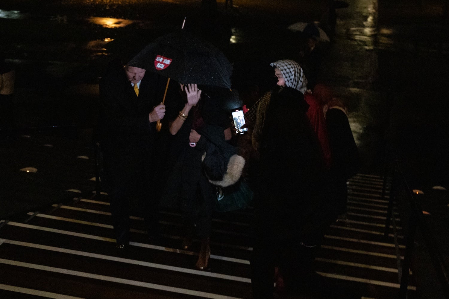 Pro-Palestine protesters heckle Harvard donors as they enter Widener Library for a dinner to celebrate donors who contribute more than $25,000 to the Harvard College Fund.