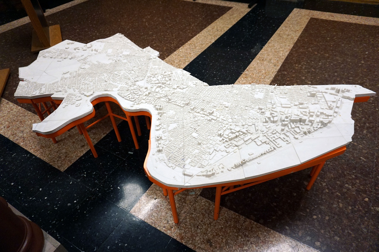 A model of the city of Cambridge sits in City Hall in 2018. Just as Simmons is defined by Cambridge, she has, by many measures, defined the city in return.