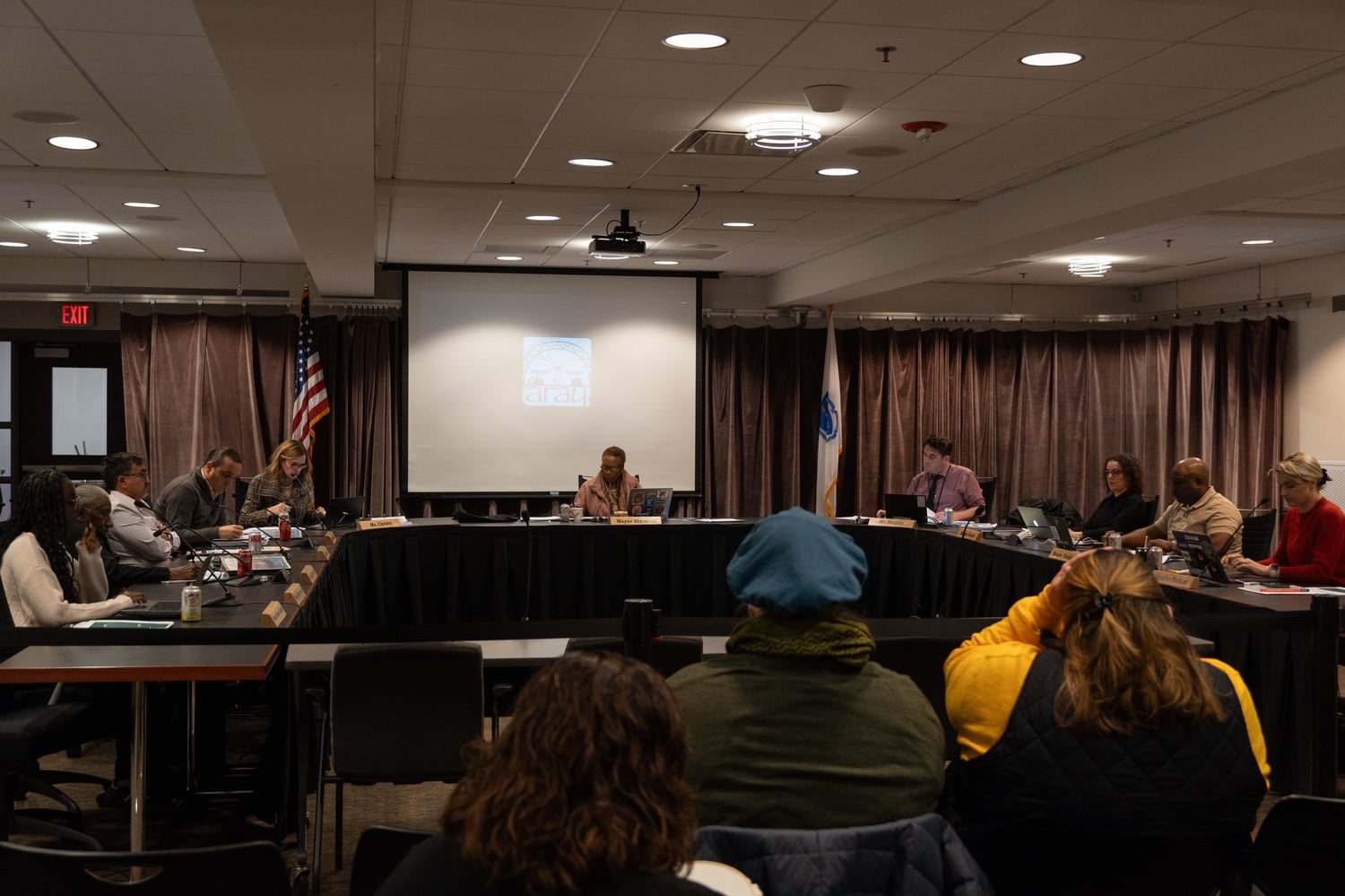 Cambridge leaders gather for a school committee meeting Tuesday. At the meeting, school committee members wondered aloud whether the district needed to close K-Lo.