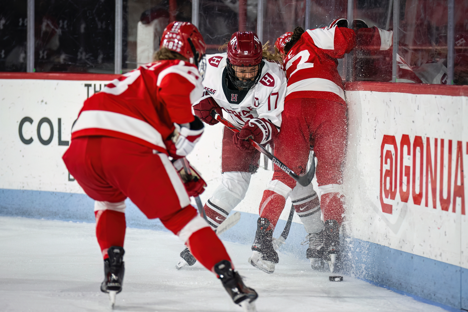 Senior Ellie Bayard fights for the puck against Boston University in the Beanpot tournament.