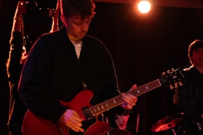 Cover image for The Backfires Guitarist