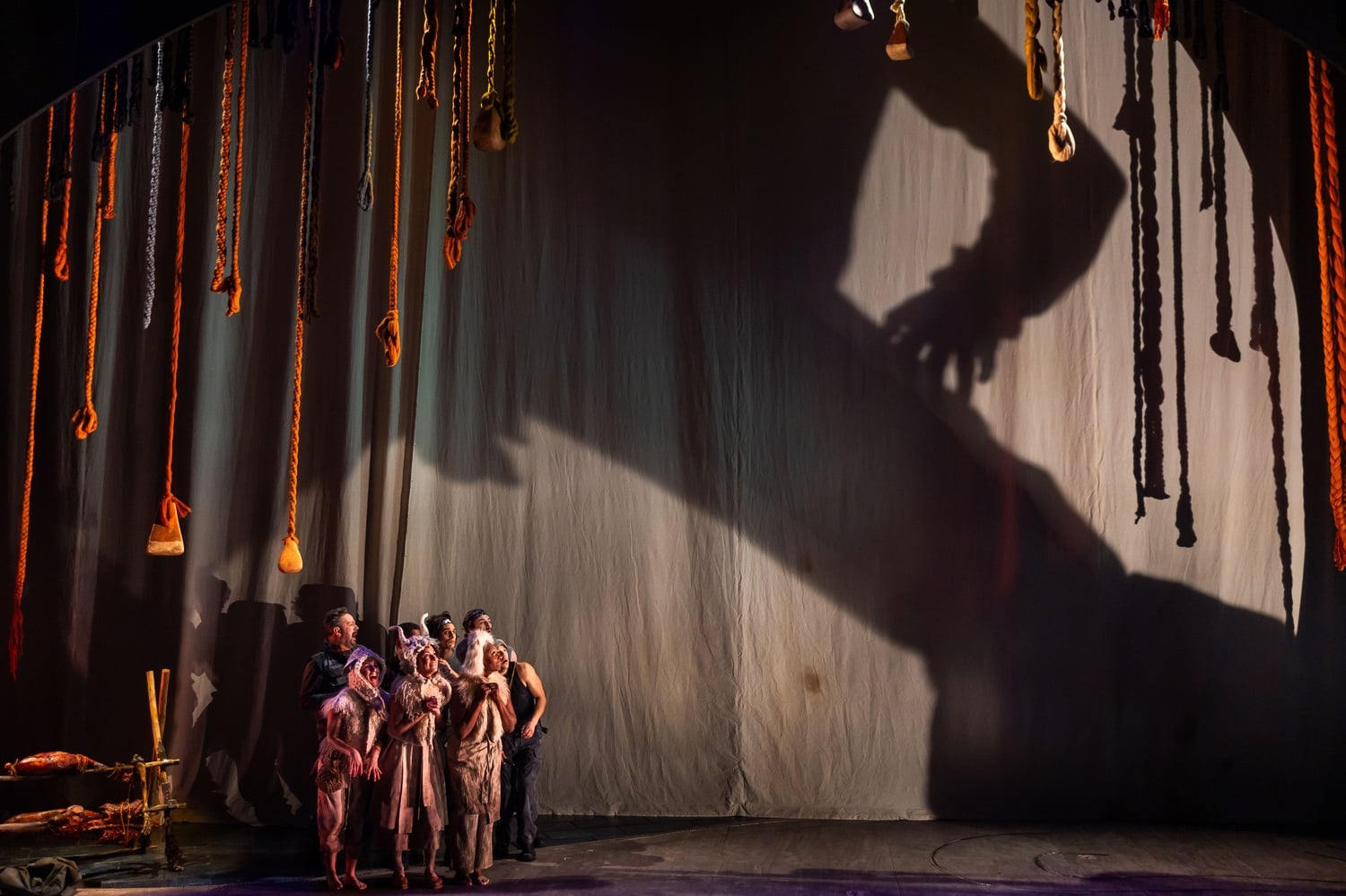 Members of the cast face Polyphemus in A.R.T.'s world-premiere production of "The Odyssey."