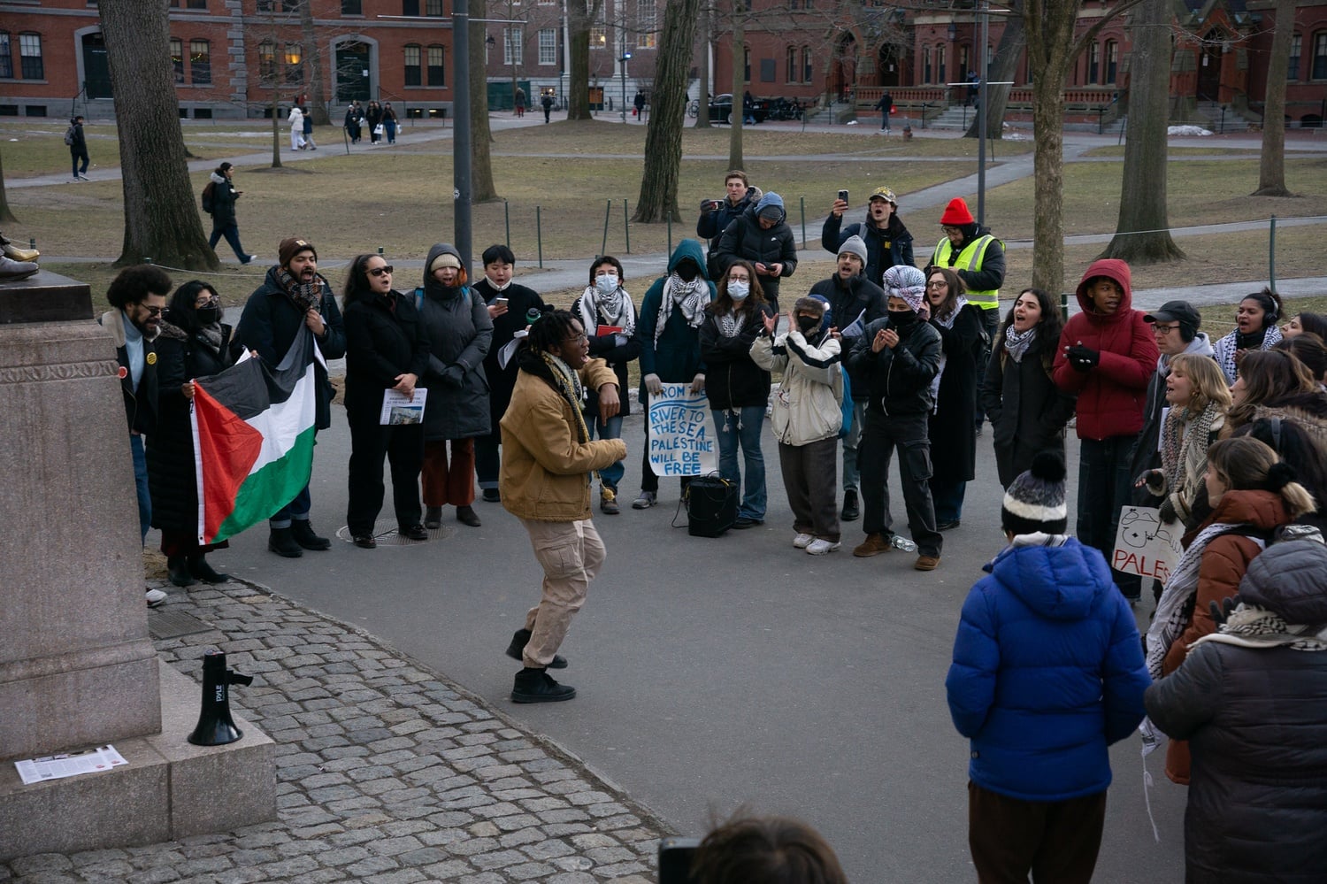 Harvard affiliates rallied on Monday in Harvard Yard to protest Israel’s deployment of tanks into the West Bank last week.