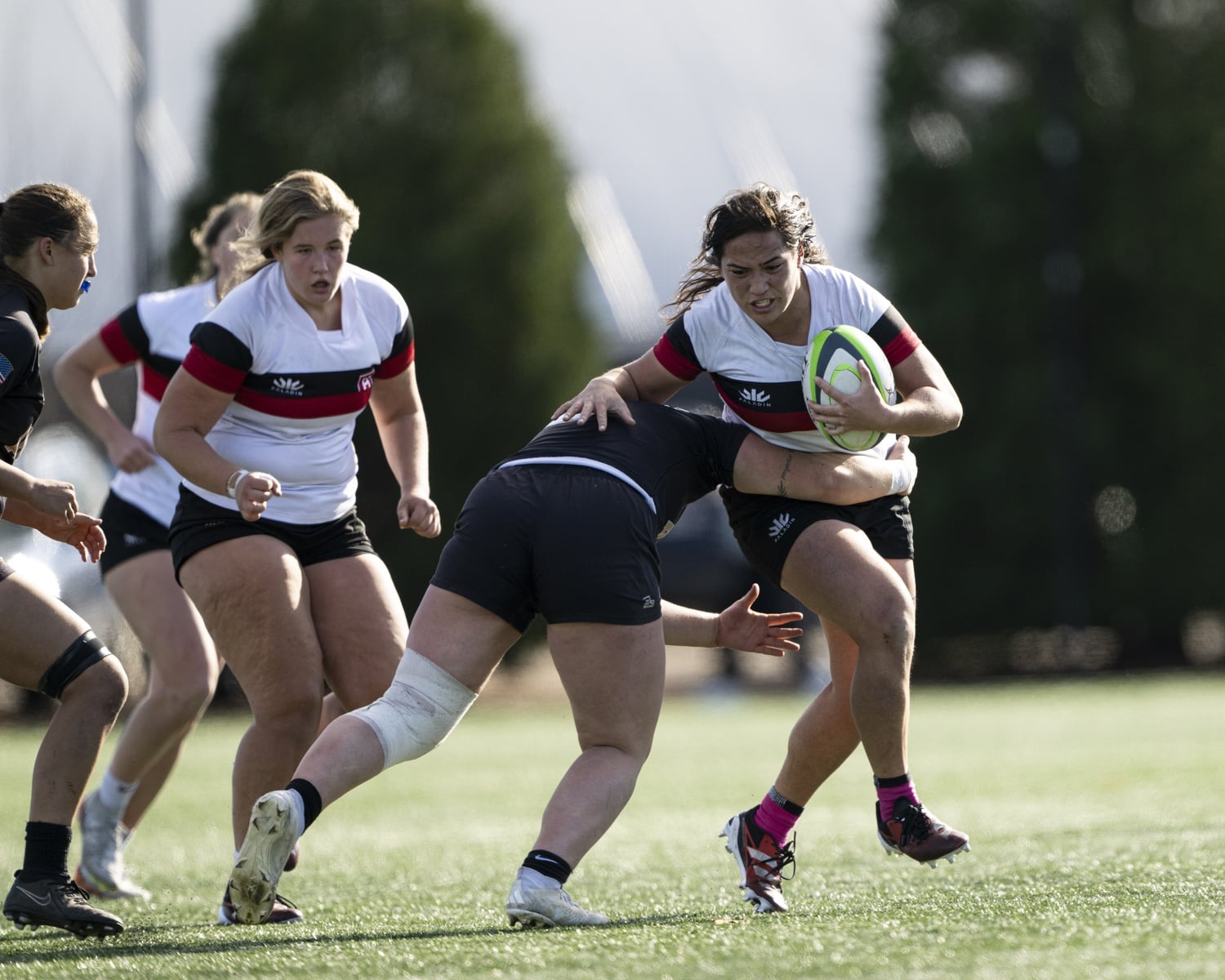 Fitisemanu, fighting through a tackle, will serve as Harvard's rugby captain in 2025.